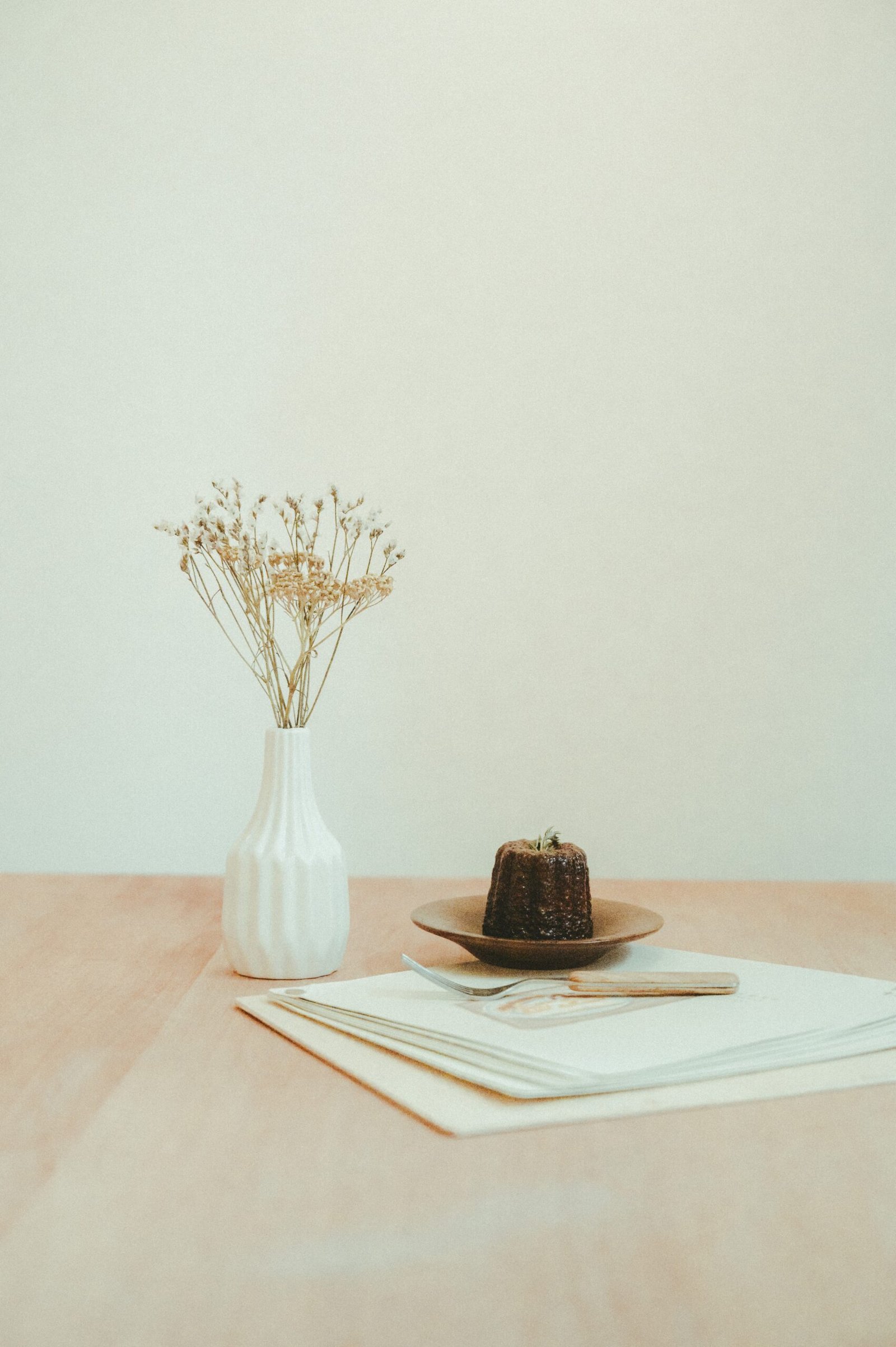 brown and black chocolate cake on white ceramic plate