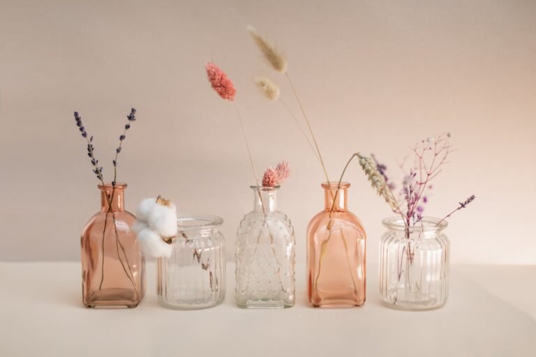 decoration of ornate glass carafes and jars with dried grass