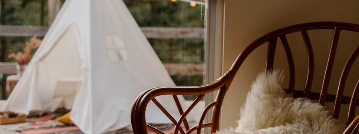 interior of room with wicker furniture and wigwam on terrace