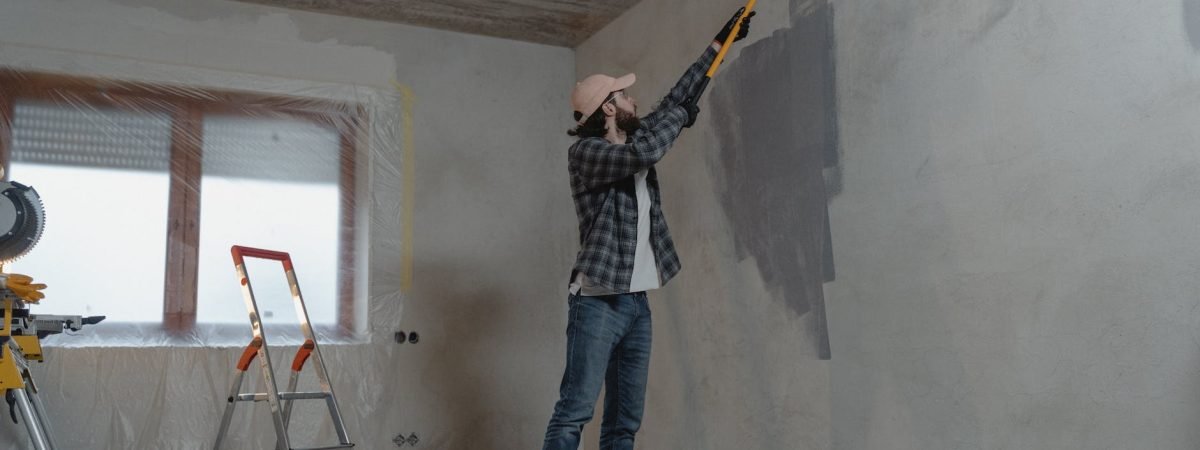 man painting the wall