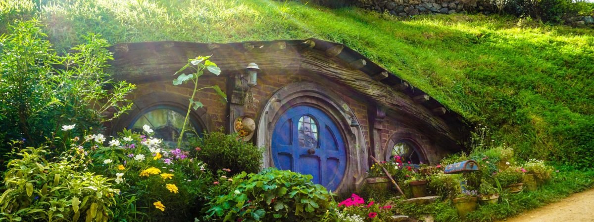 underground house covered with green grass and plants